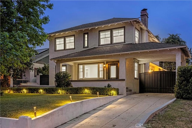 1281 E Orange Grove Blvd, Pasadena, CA 91104 - view of front facade with stucco siding, a chimney, and a front lawn