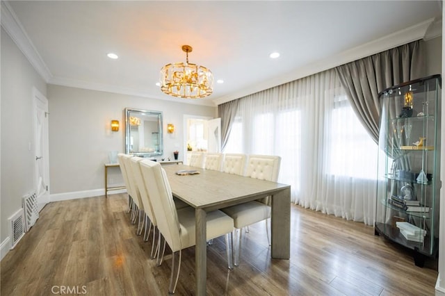1281 E Orange Grove Blvd, Pasadena, CA 91104 - dining room with a chandelier, crown molding, wood finished floors, recessed lighting, and baseboards