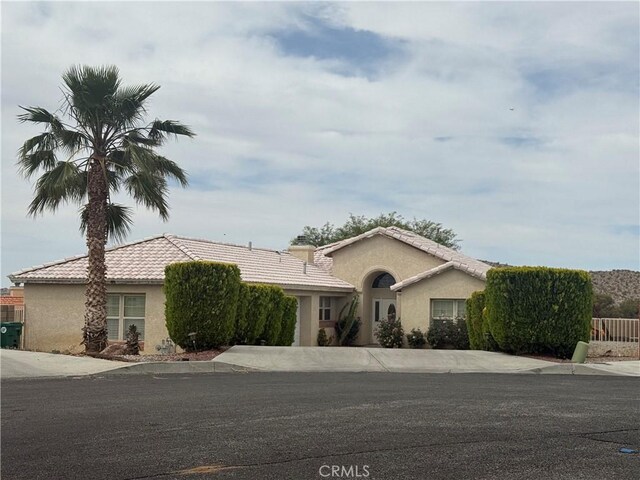 8520 Bolero Dr, Yucca Valley, CA 92284 - view of front of home with stucco siding and a tiled roof