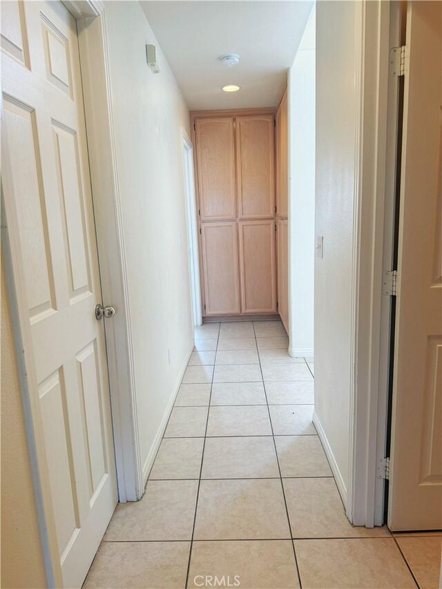 8520 Bolero Dr, Yucca Valley, CA 92284 - hall with baseboards and light tile patterned flooring