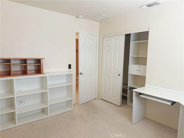 8520 Bolero Dr, Yucca Valley, CA 92284 - unfurnished bedroom with light colored carpet and a closet