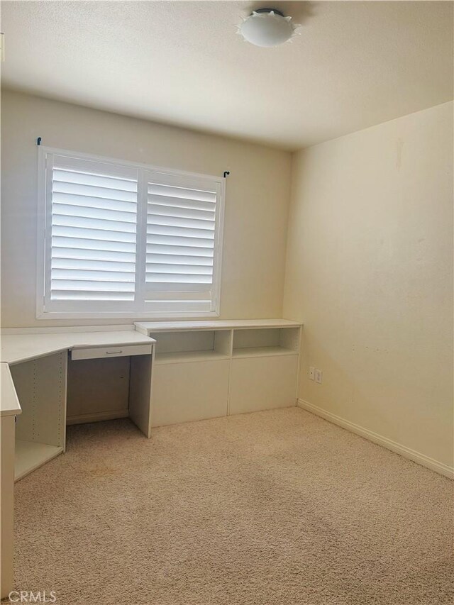 8520 Bolero Dr, Yucca Valley, CA 92284 - unfurnished office featuring light carpet and plenty of natural light
