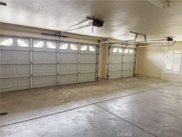 8520 Bolero Dr, Yucca Valley, CA 92284 - garage featuring a garage door opener