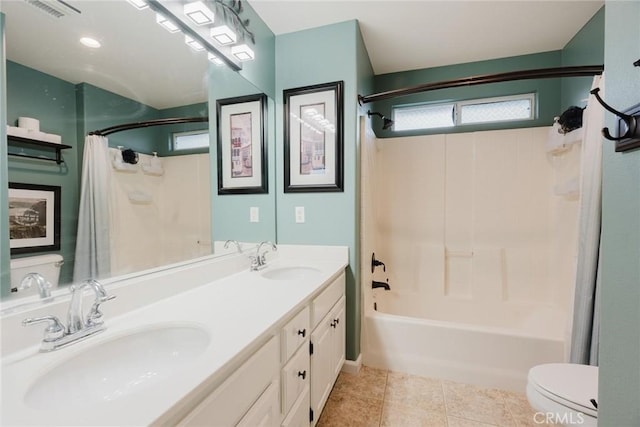 20019 Franks Way, Saugus, CA 91350 - bathroom featuring shower / bath combo with shower curtain, toilet, double vanity, and tile patterned floors