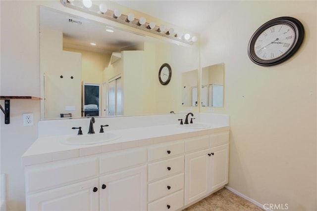 20019 Franks Way, Saugus, CA 91350 - bathroom featuring double vanity, ensuite bathroom, and baseboards