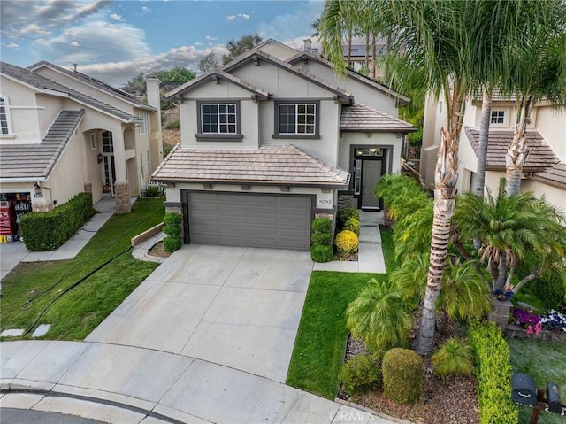 20019 Franks Way, Saugus, CA 91350 - view of front facade featuring a garage, stucco siding, concrete driveway, a front yard, and stone siding