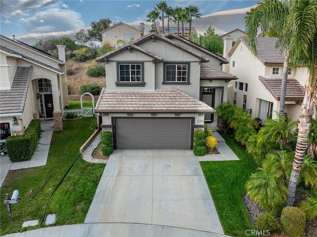 20019 Franks Way, Saugus, CA 91350 - view of front of property with concrete driveway, stucco siding, a front yard, and an attached garage