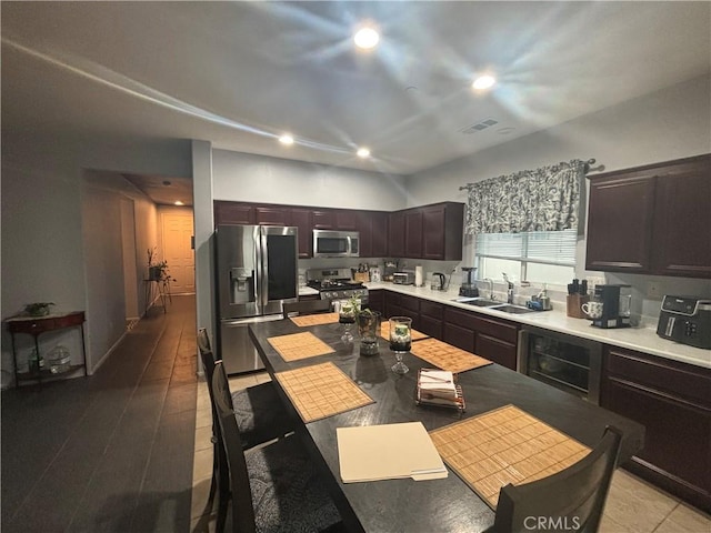 1884 Glow Pointe, San Jacinto, CA 92582 - kitchen with appliances with stainless steel finishes, a sink, recessed lighting, light countertops, and dark brown cabinetry