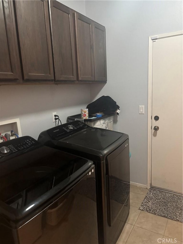 1884 Glow Pointe, San Jacinto, CA 92582 - laundry room featuring washing machine and clothes dryer, cabinet space, and light tile patterned floors