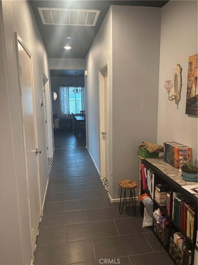 1884 Glow Pointe, San Jacinto, CA 92582 - corridor with dark tile patterned floors and baseboards