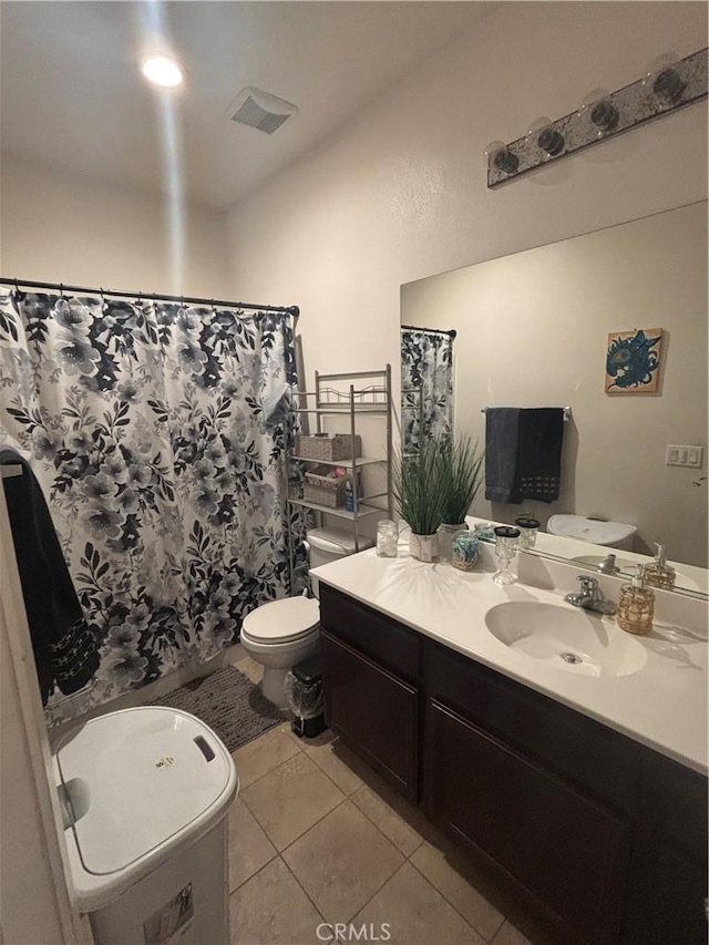 1884 Glow Pointe, San Jacinto, CA 92582 - full bathroom with vanity, toilet, tile patterned floors, and a shower with curtain