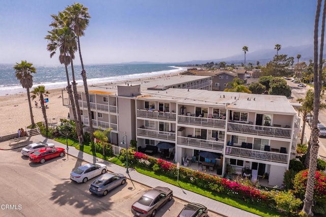 4975 Sandyland Rd Unit 302, Carpinteria, CA 93013 - view of building exterior with uncovered parking and view of water and beach