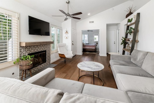 6848 Xana Way, Carlsbad, CA 92009 - living room featuring ceiling fan, vaulted ceiling, wood finished floors, a tile fireplace, and baseboards
