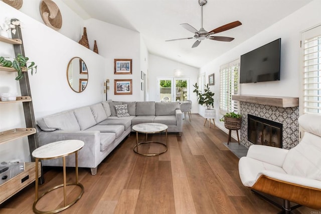 6848 Xana Way, Carlsbad, CA 92009 - living room with lofted ceiling, a ceiling fan, wood finished floors, and a fireplace with flush hearth