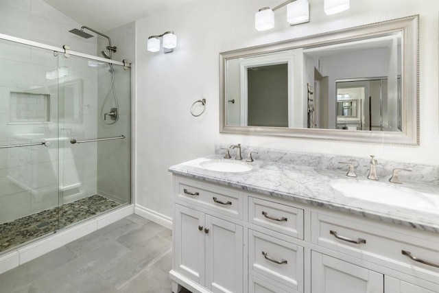 6848 Xana Way, Carlsbad, CA 92009 - bathroom with a shower stall, double vanity, and baseboards