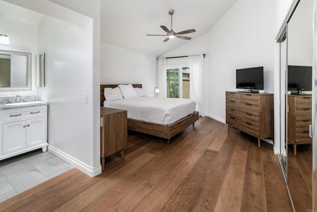 6848 Xana Way, Carlsbad, CA 92009 - bedroom with lofted ceiling, baseboards, light wood-type flooring, a sink, and ceiling fan
