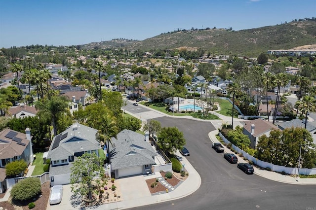 6848 Xana Way, Carlsbad, CA 92009 - aerial overview of property's location featuring nearby suburban area, a mountain backdrop, and a pool
