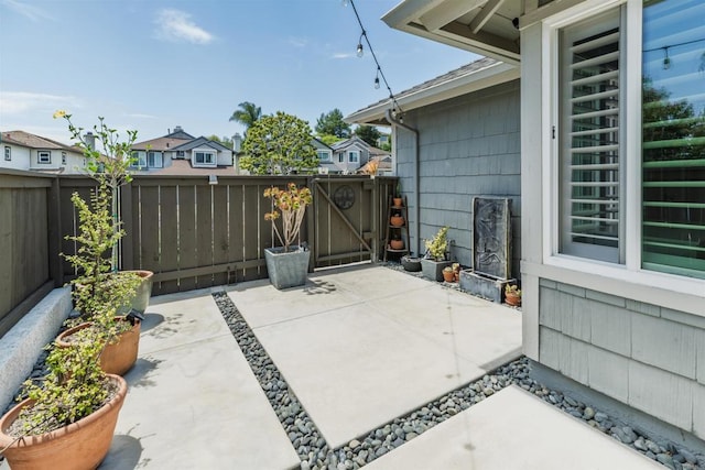 6848 Xana Way, Carlsbad, CA 92009 - fenced backyard with a patio, a gate, and a residential view