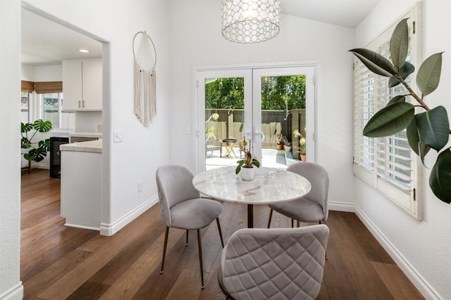 6848 Xana Way, Carlsbad, CA 92009 - dining area with french doors, plenty of natural light, dark wood finished floors, baseboards, and lofted ceiling