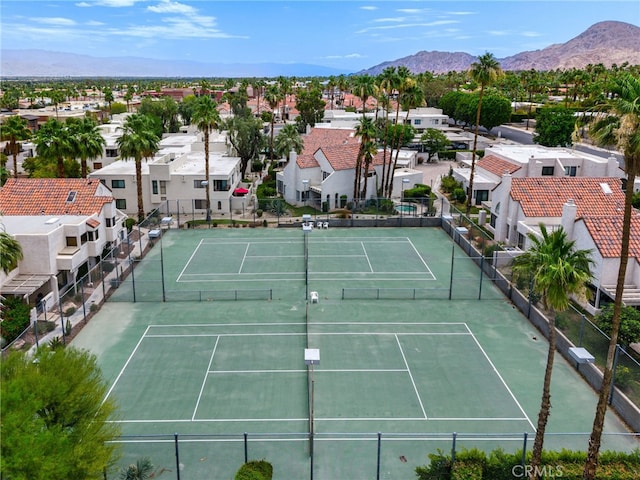 45405 Lupine Ln Unit 16, Palm Desert, CA 92260 - view of tennis court with a residential view and a mountain view