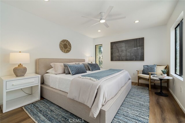 45405 Lupine Ln Unit 16, Palm Desert, CA 92260 - bedroom featuring multiple windows, wood finished floors, baseboards, recessed lighting, and a ceiling fan