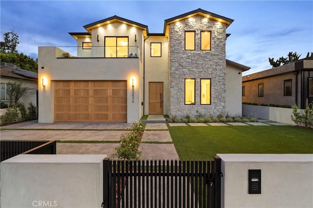 13536 Morrison St, Sherman Oaks, CA 91423 - contemporary house featuring stone siding, a balcony, stucco siding, a gate, and an attached garage