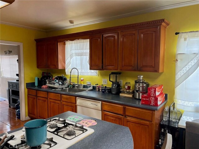 2730 Walnut St, Huntington Park, CA 90255 - kitchen featuring white appliances, a sink, dark countertops, dark tile patterned flooring, and crown molding