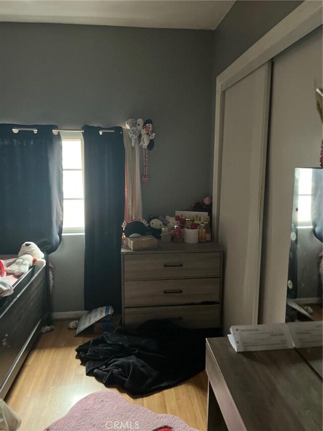 2730 Walnut St, Huntington Park, CA 90255 - bedroom featuring light wood-style floors and a closet