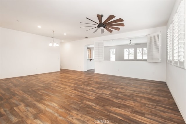 1171 Otano Way, Oxnard, CA 93030 - unfurnished living room with a ceiling fan, a chandelier, wood finished floors, arched walkways, and recessed lighting