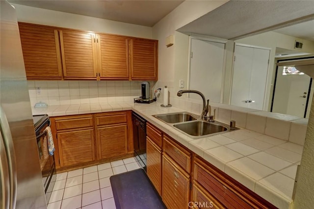 25712 Le Parc Unit 7, Lake Forest, CA 92630 - kitchen with a sink, range with electric stovetop, tasteful backsplash, tile counters, and light tile patterned floors