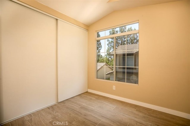 369 Chaumont Cir, Lake Forest, CA 92610 - spare room with lofted ceiling and wood finished floors