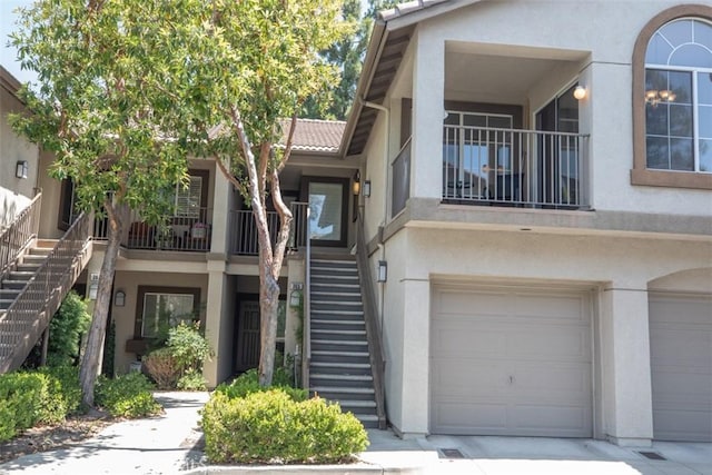 369 Chaumont Cir, Lake Forest, CA 92610 - view of front of house with stairs, stucco siding, a garage, a tile roof, and driveway