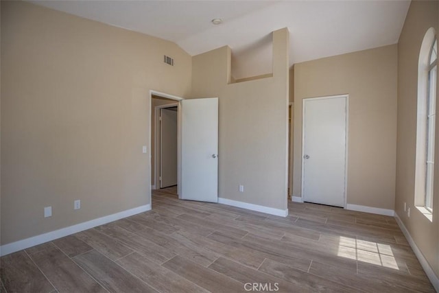 369 Chaumont Cir, Lake Forest, CA 92610 - unfurnished bedroom with wood finished floors and high vaulted ceiling