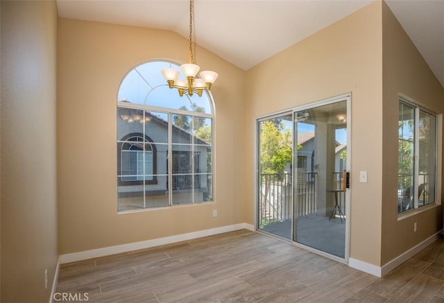 369 Chaumont Cir, Lake Forest, CA 92610 - unfurnished dining area featuring a chandelier, wood finished floors, and vaulted ceiling