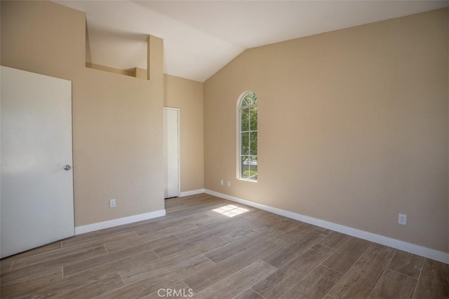 369 Chaumont Cir, Lake Forest, CA 92610 - unfurnished bedroom with wood finished floors and vaulted ceiling