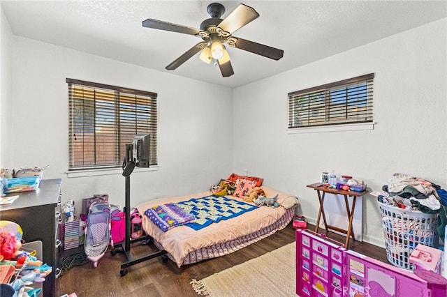 3546 Kenmill St, Riverside, CA 92504 - bedroom featuring wood finished floors, multiple windows, a ceiling fan, and baseboards