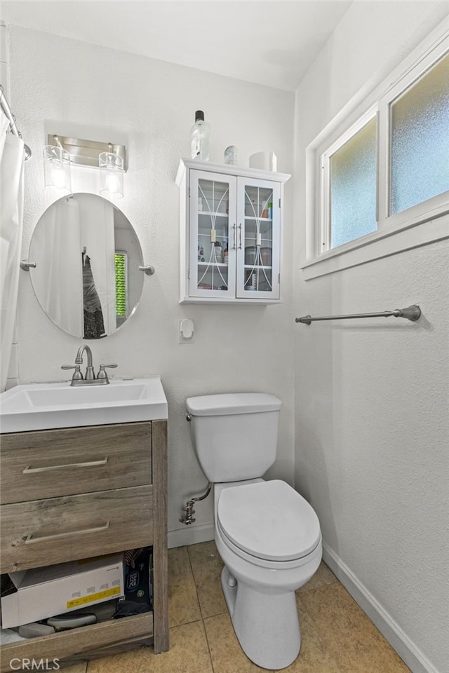 3546 Kenmill St, Riverside, CA 92504 - full bathroom featuring vanity, baseboards, toilet, and tile patterned flooring