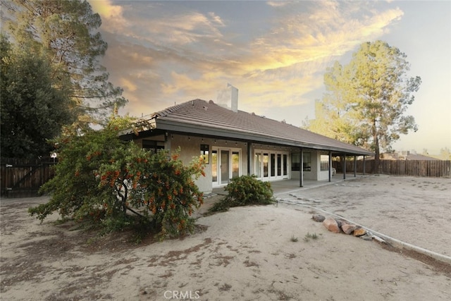 19355 Tomahawk Rd, Apple Valley, CA 92307 - back of property featuring a chimney and a patio