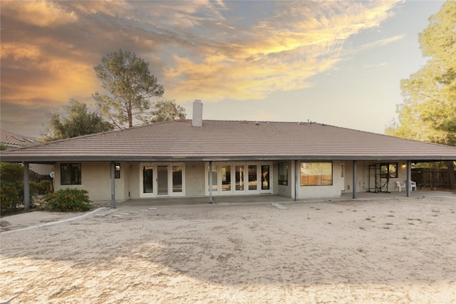 19355 Tomahawk Rd, Apple Valley, CA 92307 - back of property featuring a chimney, a tile roof, a patio, and french doors