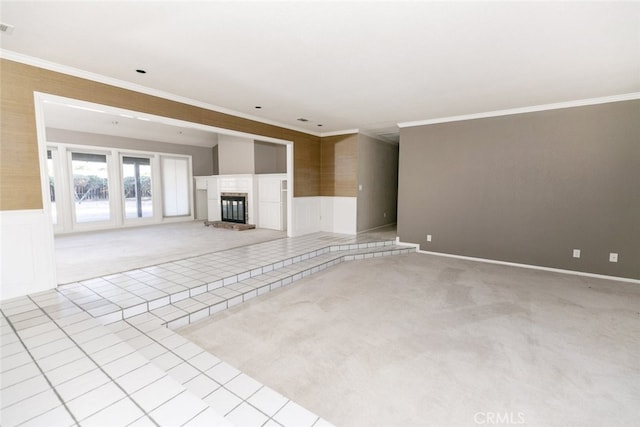 19355 Tomahawk Rd, Apple Valley, CA 92307 - unfurnished living room featuring crown molding, carpet floors, wainscoting, and a glass covered fireplace
