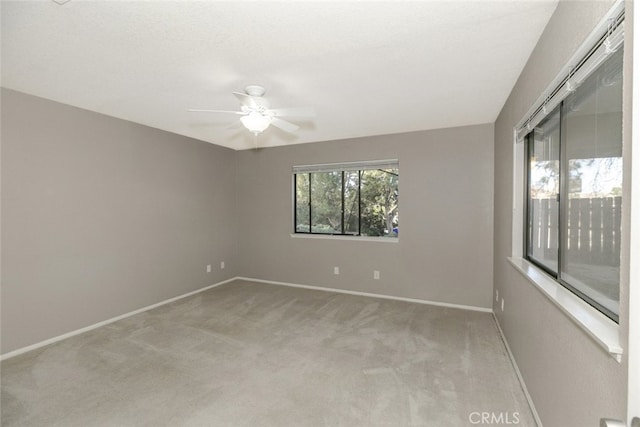 19355 Tomahawk Rd, Apple Valley, CA 92307 - spare room featuring light colored carpet, ceiling fan, and baseboards