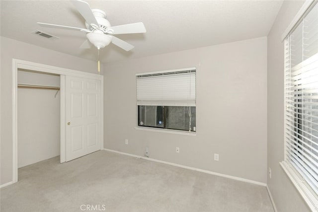 19355 Tomahawk Rd, Apple Valley, CA 92307 - unfurnished bedroom featuring light colored carpet, a closet, baseboards, and a ceiling fan