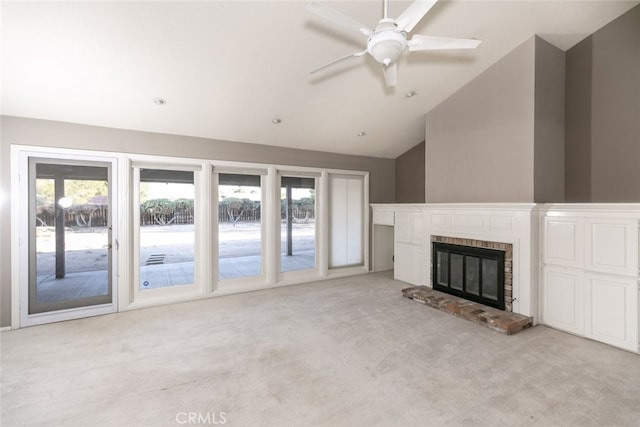 19355 Tomahawk Rd, Apple Valley, CA 92307 - unfurnished living room with light carpet, vaulted ceiling, a ceiling fan, and a brick fireplace