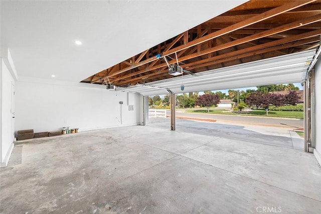 1563 Gary Ln, Redlands, CA 92374 - garage featuring a garage door opener and recessed lighting