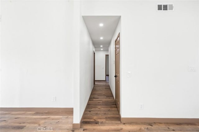 1563 Gary Ln, Redlands, CA 92374 - hallway with recessed lighting, light wood finished floors, and baseboards
