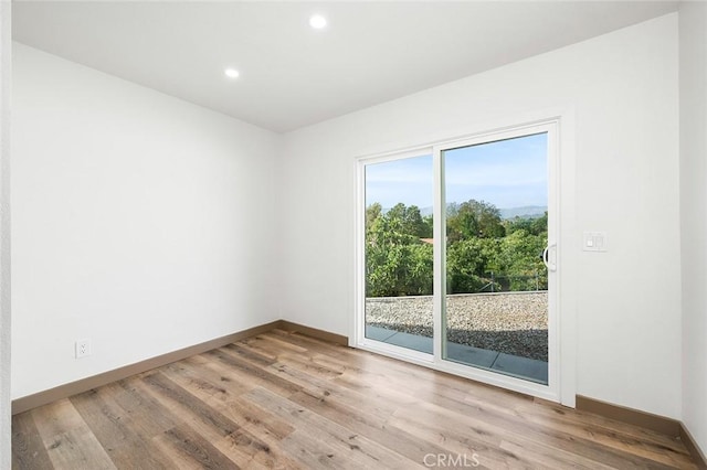 1563 Gary Ln, Redlands, CA 92374 - spare room featuring wood finished floors, recessed lighting, and baseboards