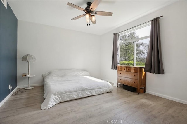 30902 Clubhouse Dr Unit 27D, Laguna Niguel, CA 92677 - bedroom featuring wood finished floors, baseboards, and a ceiling fan