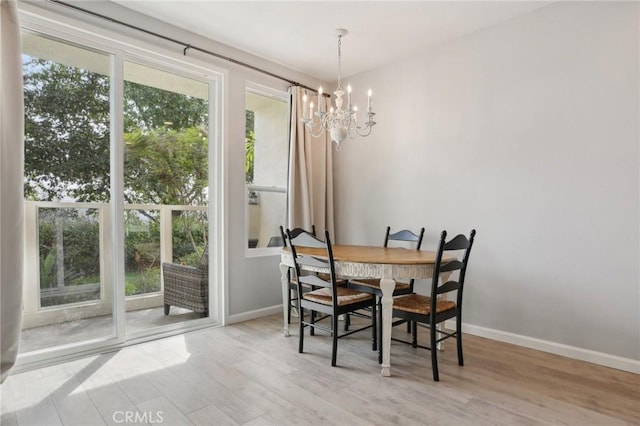 30902 Clubhouse Dr Unit 27D, Laguna Niguel, CA 92677 - dining area featuring a chandelier and wood finished floors