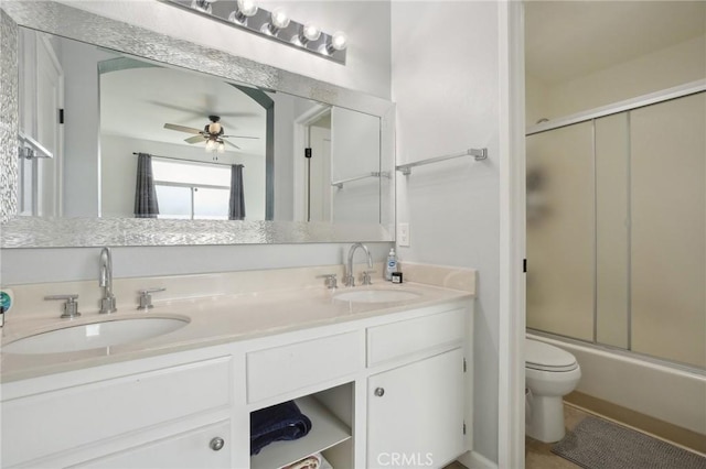 30902 Clubhouse Dr Unit 27D, Laguna Niguel, CA 92677 - bathroom with double vanity, a ceiling fan, combined bath / shower with glass door, and tile patterned flooring