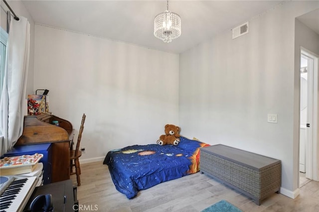 30902 Clubhouse Dr Unit 27D, Laguna Niguel, CA 92677 - bedroom featuring wood finished floors and a chandelier